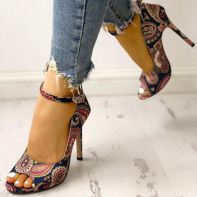 Stylish printed toe buckle high heels with a low-cut design and bag heel back, featuring a decorative buckle and vibrant print on the toe, set against a sleek silhouette.