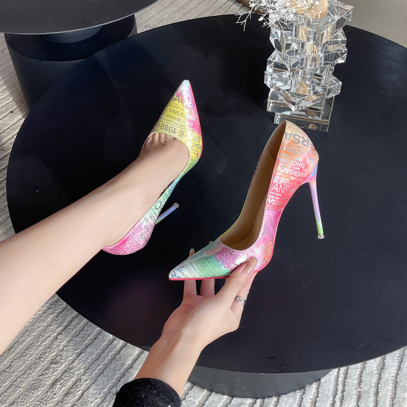 Colorful pointed-toe stiletto heels with a chic shallow mouth design and red bottom. 