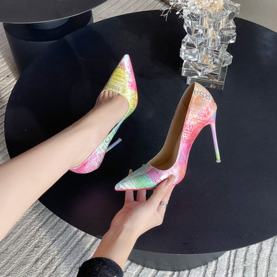 Colorful pointed-toe stiletto heels with a chic shallow mouth design and red bottom. 