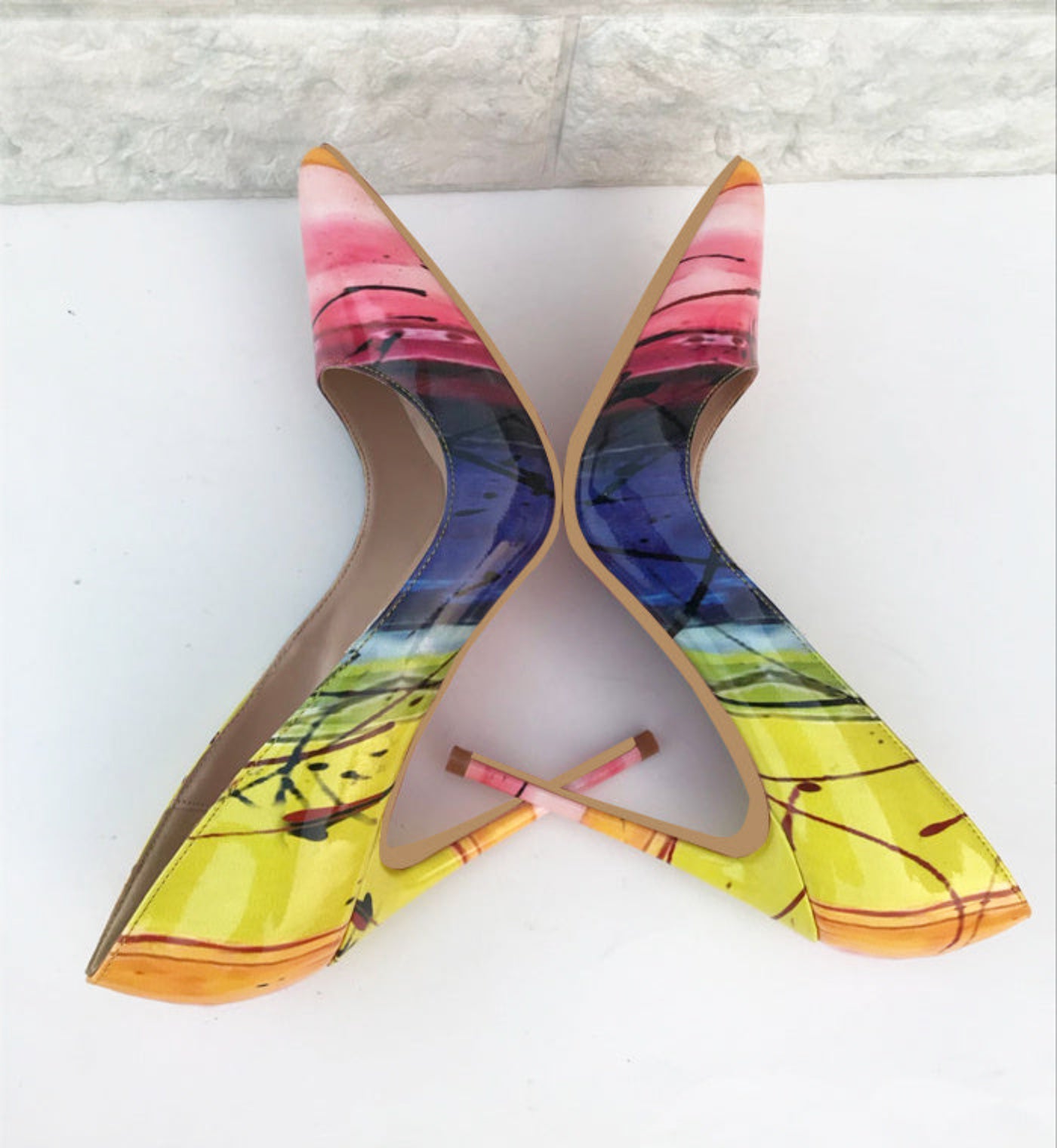 Bright yellow high heels with a pointed toe and high stiletto heel for a bold, stylish look.